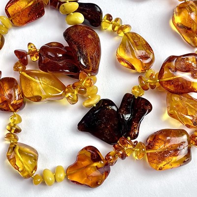 Lot 715 - A raw amber bead necklace, with irregular...