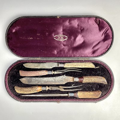 Lot 45 - A Victorian cased meat carving set with antler...