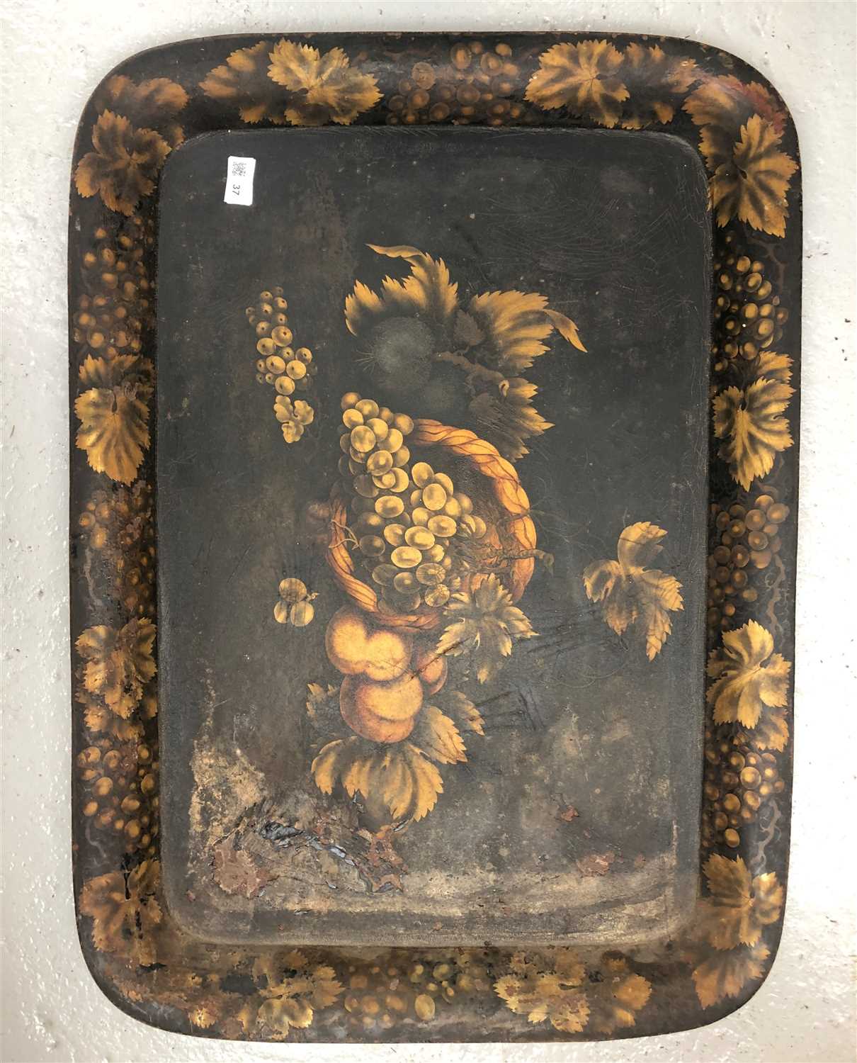 Lot 37 - A Victorian tole-peinte tray painted with fruit.
