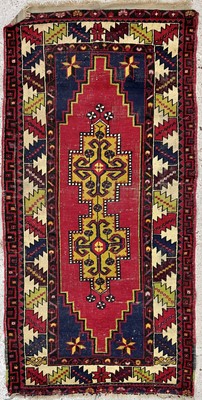 Lot 1204 - A North West Persian rug, of Caucasian design,...