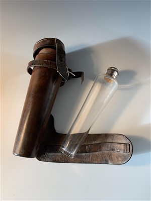 Lot 31 - A glass hunting flask in leather case.