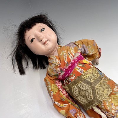 Lot 68 - A Japanese composition head doll, 20th century,...