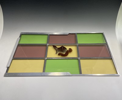 Lot 51 - A square stained glass panel with a...
