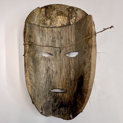 Lot 74 - An African mask with snakeskin detail, length...