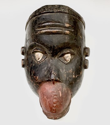 Lot 78 - An African wood carved mask, length 29.5cm.