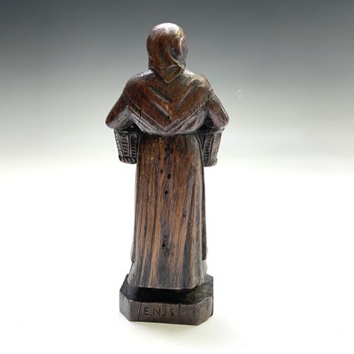 Lot 210 - A carved oak figure of a Dutch peasant, 19th...