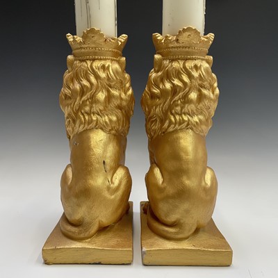 Lot 111 - Pair of gold painted lions with candles,...
