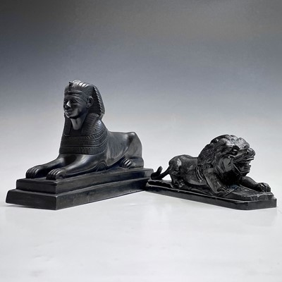 Lot 112 - A black onyx carved recumbent lion and a...