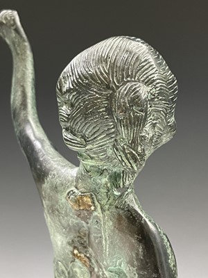 Lot 113 - A cast metal figure of putto indistinctly...