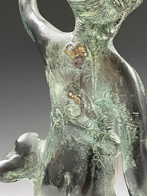 Lot 113 - A cast metal figure of putto indistinctly...