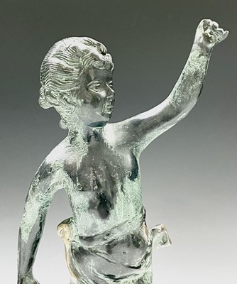 Lot 113 - A cast metal figure of putto indistinctly...
