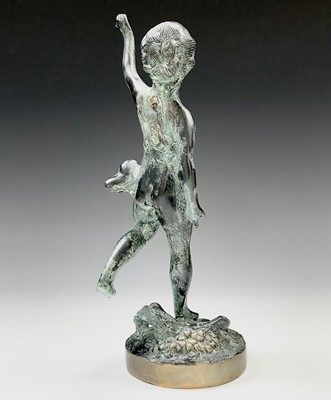 Lot 113 - A cast metal figure of putto indistinctly...