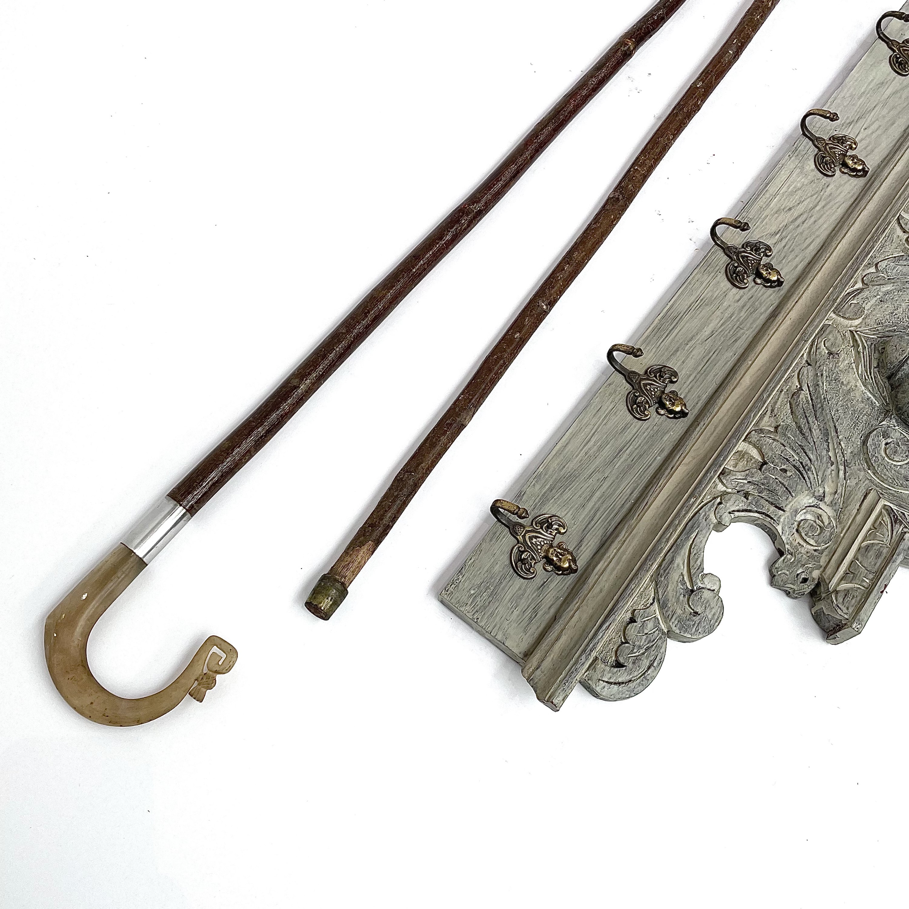 Lot 196 A painted oak coat rack with five brass