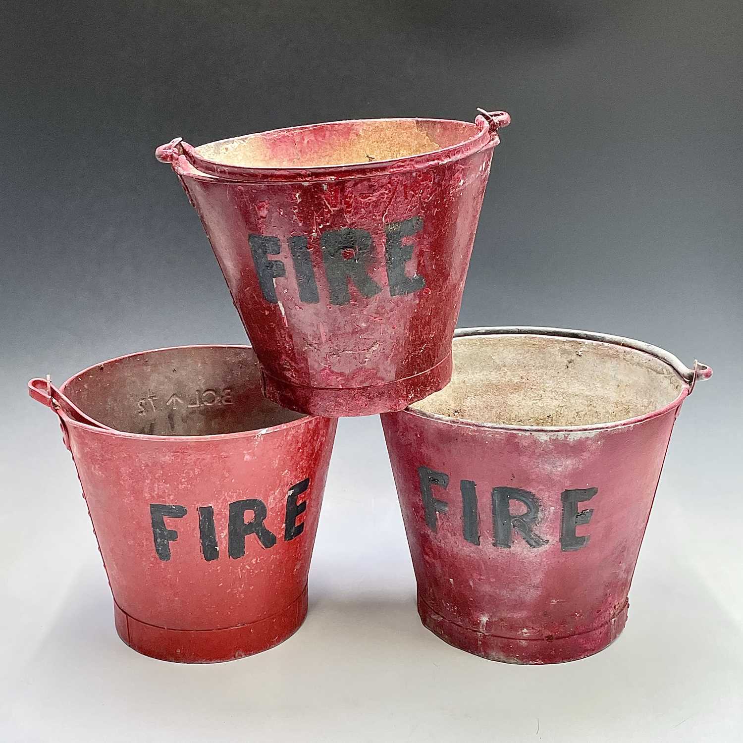Lot 175 - Three red painted 'FIRE' buckets, one with a