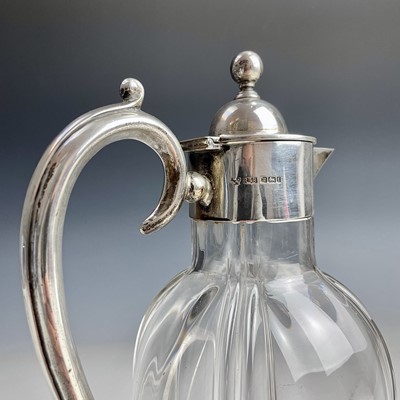 Lot 51 - A Victorian silver mounted glass claret jug by...