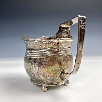 Lot 63 - A George III silver milk jug with ribbed...