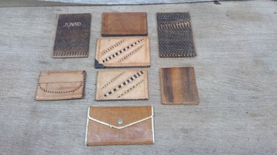 Lot 24 - Eight Wallets. A Combination of Worked Leather,...