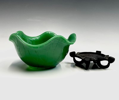 Lot 62 - A Chinese Peking green glass bowl, on carved...