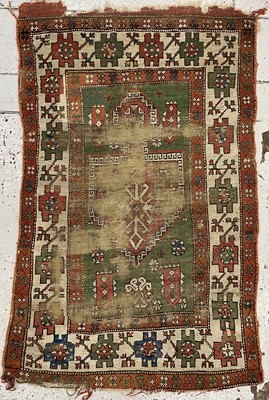 Lot 1212 - A Turkish tribal rug, 19th century, the green...