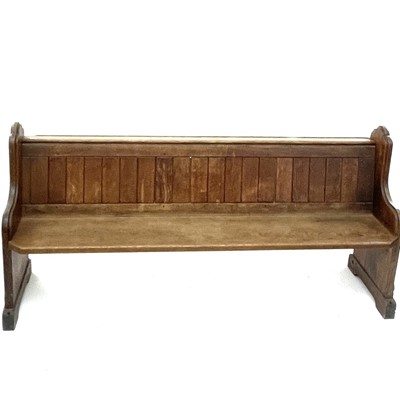 Lot 3031 - A late Victorian oak pew, with panelled back...