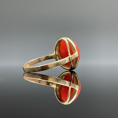 Lot 713 - A modern 18ct gold coral set dress ring,...