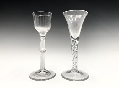 Lot 1013 - An early George III wine glass, the ogee bowl...