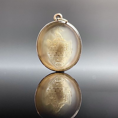 Lot 871 - A 19th century gold mounted oval carved stone...