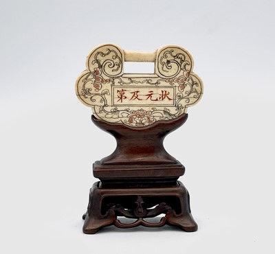 Lot 180 - A Chinese scholars ivory plaque, on hardwood...