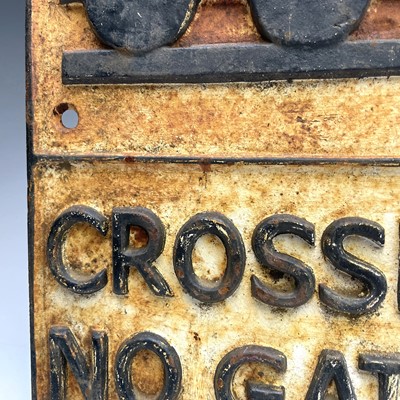 Lot 152 - A cast metal sign 'CROSSING NO GATES', 58cm x...