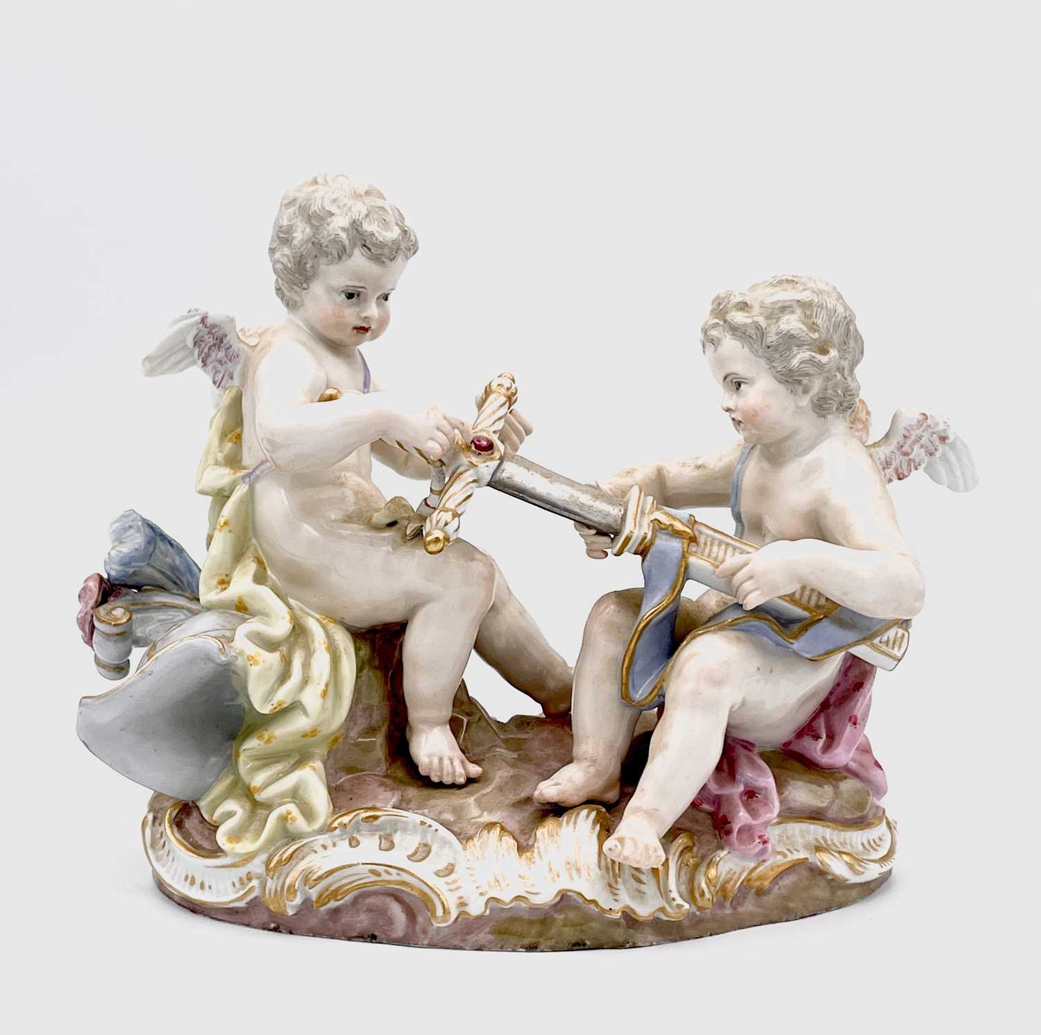 Lot 823 - A Meissen figure of two cherubs unsheathing a...