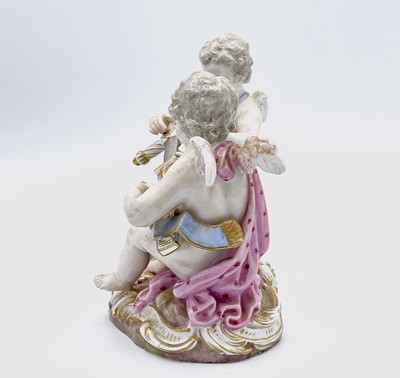 Lot 823 - A Meissen figure of two cherubs unsheathing a...