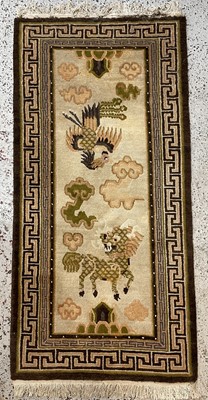 Lot 1215 - A Tibetan design rug, mid 20th century, with...