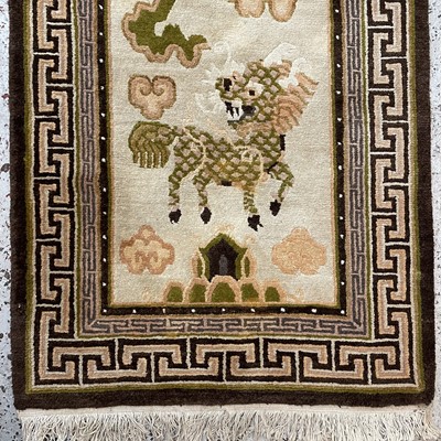 Lot 1215 - A Tibetan design rug, mid 20th century, with...