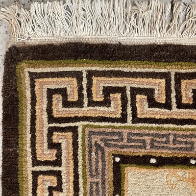 Lot 1215 - A Tibetan design rug, mid 20th century, with...