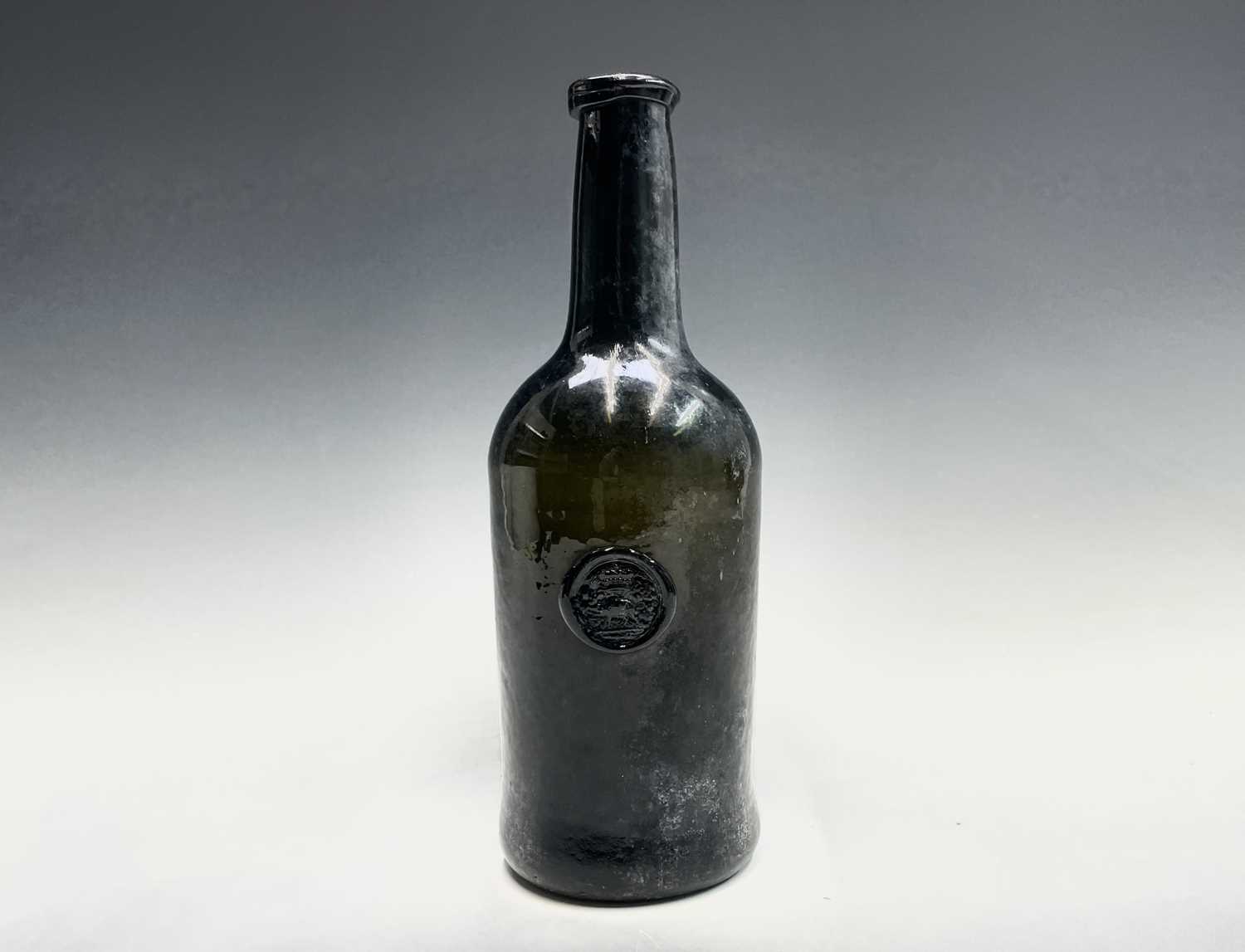 Lot 804 - A mid 18th century sealed wine bottle, thick...