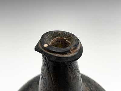 Lot 806 - An early 18th century green onion wine bottle,...