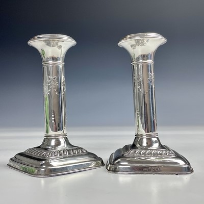 Lot 73 - A pair of George V silver candlesticks by...