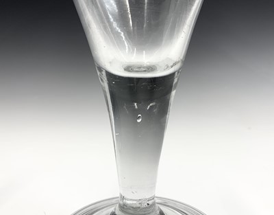 Lot 994 - A Georgian glass goblet, the funnel bowl on a...