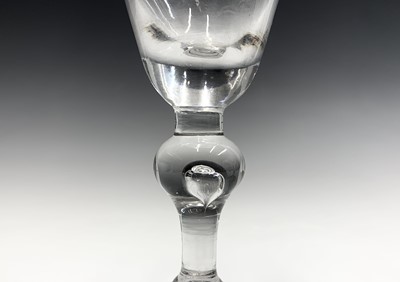 Lot 994 - A Georgian glass goblet, the funnel bowl on a...