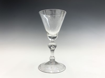Lot 994 - A Georgian glass goblet, the funnel bowl on a...