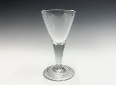 Lot 994 - A Georgian glass goblet, the funnel bowl on a...
