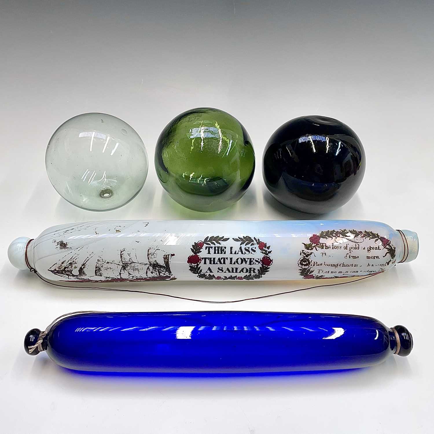 Lot 993 - A Victorian opaque glass rolling pin, transfer...