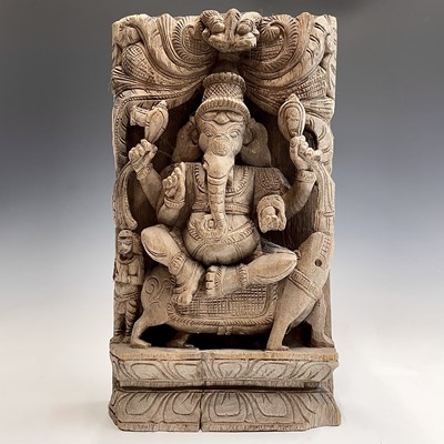 Lot 1016 - A large Indian carved wood panel of Ganesh,...