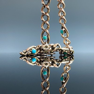 Lot 891 - An Edwardian 9ct rose gold turquoise set curb...