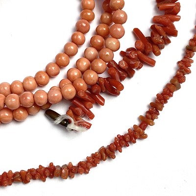 Lot 629 - A long coral bead necklace with gilt metal...