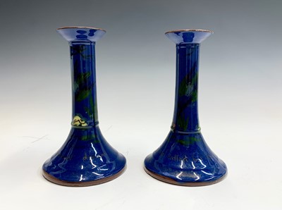 Lot 991 - A pair of Torquay ware candle holders of local...