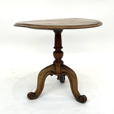 Lot 3029 - A Victorian walnut circular games table with...