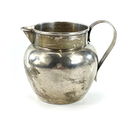 Lot 183 - A George V silver ovoid cream jug, Birmingham...