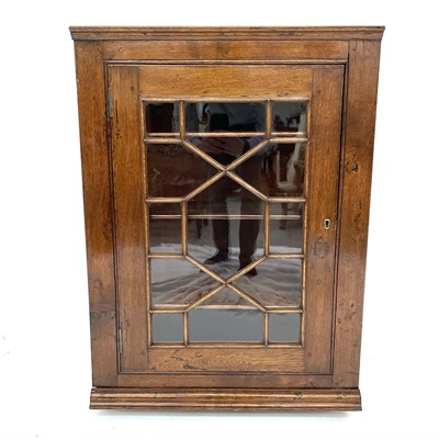 Lot 3025 - A 19th century oak hanging corner cupboard...