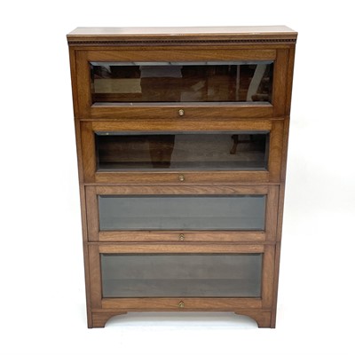 Lot 3024 - A walnut sectional bookcase of Globe Wernicke...